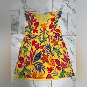 Emily wonder yellow dress with big flowers.